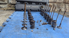 Load image into Gallery viewer, Valve set of 16 removed from a Volvo B234F engine.
