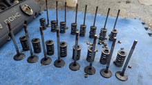 Load image into Gallery viewer, Valve set of 16 removed from a Volvo B234F engine.
